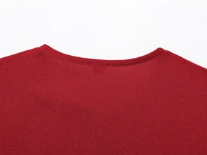 Close-up of crew neckline and premium cotton linen texture on a dark red jacket