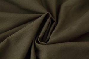 Detailed macro view of deep olive green woven fabric with smooth matte texture and pleats