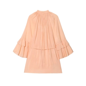 Detail of pleated collar and layered ruffle sleeves on silk-like apricot satin dress