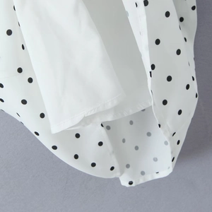 Robe dos nu vintage à pois avec doublure intérieure lisse et finitions de couture soignées