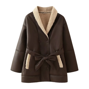 Detail of dark brown faux leather coat with white shearling trim and tie-waist belt