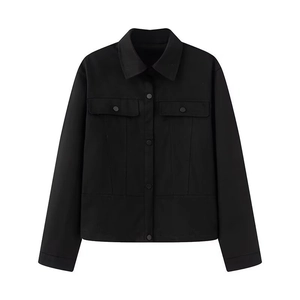 Close-up of black cargo jacket featuring a classic collar and dual chest utility pockets