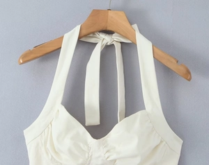 Detailed halter neck tie with delicate bow on back of ivory slim fit corset top