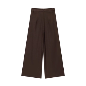 Flat lay of wide-leg dark brown trousers with waist loops and vertical pleat details