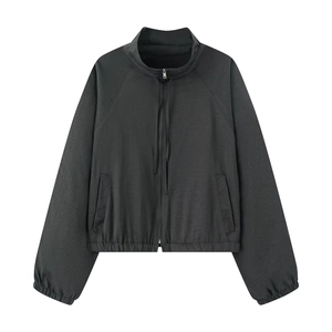Detail of black cropped sports jacket with stand collar and zipper made of quick-dry fabric