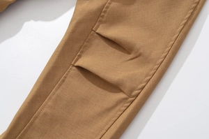 Detailed close-up showing the twill fabric texture and pocket stitching of khaki shorts