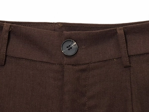 Detailed view of dark brown casual trousers showing belt loops and resin button