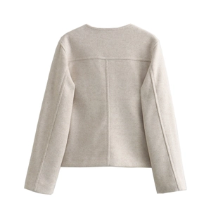Rear view of oatmeal textured wool jacket showing precise back stitching and round neck detail