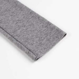 Detailed close-up of grey fine knit cuff showing premium fabric texture and neat stitching