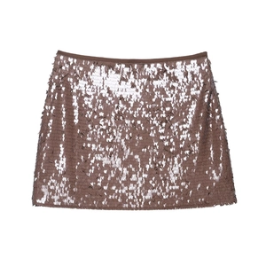 Detailed close-up of brown sequins on a low waist mini skirt with metallic texture