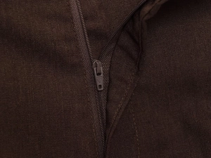 Close-up detail of dark brown woven fabric and matching resin zipper for the two-piece set