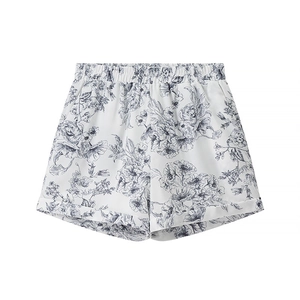 Elegant white floral print shorts for women with elastic waist and stylish cuffed hems