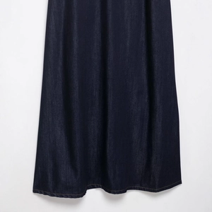 Classic deep indigo denim maxi dress for women featuring contrast yellow stitching at hemline