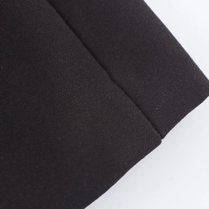 Macro view of high-density black woven fabric texture with precise stitching detail