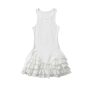 White sleeveless dress with bow detail and layered ruffled skirt on a white background