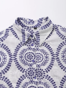White long-sleeved shirt with purple hollow embroidery and classic turn-down collar