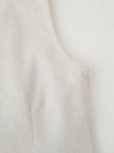 Detailed texture of beige linen fabric with high-quality stitching on sleeveless vest