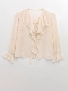 Women's apricot Swiss dot long sleeve blouse with V-neckline and ruffled details