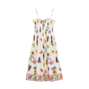 Detailed view of women's floral summer dress with fruit patterns and smocked bodice
