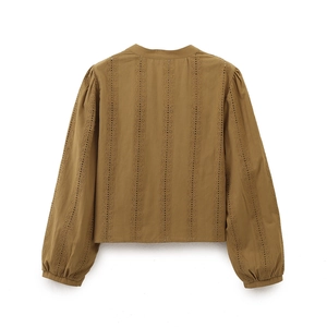 Detailed back view of brown V-neck shirt featuring vertical eyelet lace embroidery