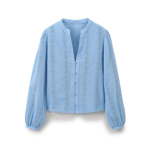 Detail of light blue V-neck blouse featuring intricate eyelet embroidery and button closure
