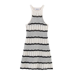 Detail of the knit texture and striped hollow pattern on the sleeveless dress