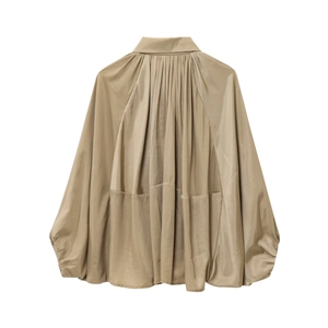 Detail of khaki satin bomber jacket with dramatic pleated cape back and lantern sleeves