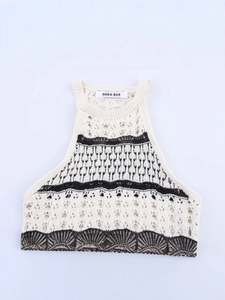 Slim fit cream knitted halter neck top with black geometric hollow patterns and chic texture