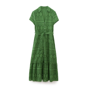 Detailed view of the grass green eyelet embroidery and button-up collar on the midi dress