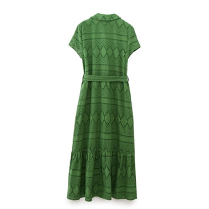 Detailed back view of green Broderie Anglaise dress featuring intricate hollow embroidery