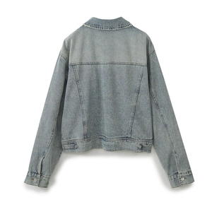 Detailed back view of vintage light blue washed denim jacket with structured seams