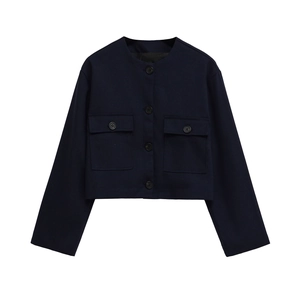 Detail of navy blue tweed jacket with front buttons and symmetrical chest pockets