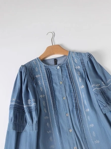 Spring vintage light blue denim midi dress with white embroidery and pleated details