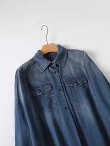 Classic blue long-sleeved denim shirt with double breast pockets and vintage wash