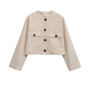 Macro detail of beige tweed jacket showing fabric texture, large pockets and black buttons