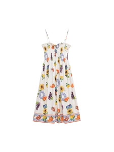 Floral backless sundress with smocked bodice and colorful fruit patterns on white background