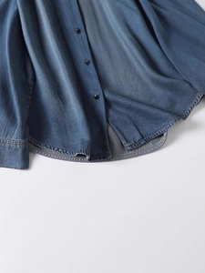Deep blue denim shirt with round hem and black buttons for casual women fashion
