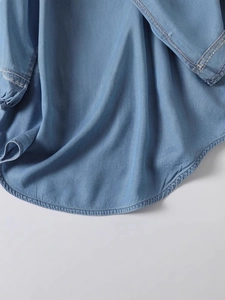Vintage light blue loose embroidery blouse with three-quarter sleeves and curved hemline