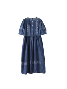 Retro dark blue denim midi dress with white embroidery and puff sleeves on white background