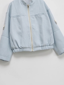 Women's light blue tweed zip-up jacket with stand collar and textured fabric design