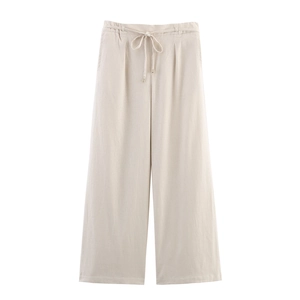 Detailed view of women's wide leg trousers with high waist and adjustable drawstring