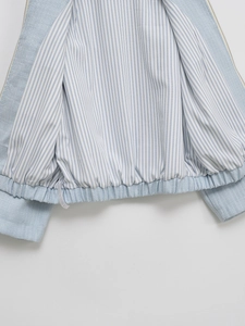 Women's light blue tweed jacket featuring a striped lining and elastic drawstring hem