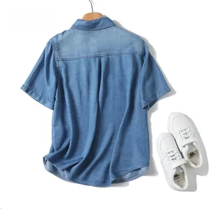 Back view of light blue tencel denim shirt with pleat detail and premium washed texture