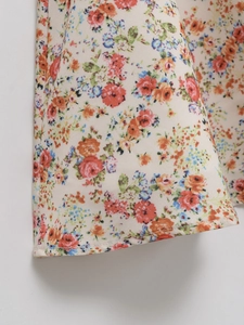 Detail of floral print summer dress showing premium cotton linen texture and neat hem stitching