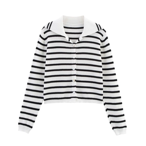 Detail view of black and white striped knit cardigan with white polo collar and buttons