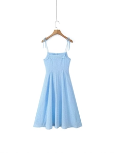 Light blue summer A-line dress with eyelet embroidery and tie-up straps on white background