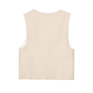 Detail view of the back of a beige textured cotton linen vest with structured seams
