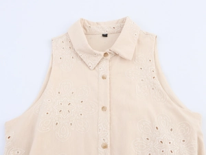 Close-up of classic collar and floral embroidery on sleeveless summer mini dress