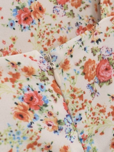 Close-up of high-quality invisible zipper and floral print texture on the summer dress
