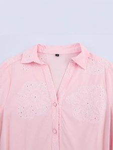 Pink short sleeve mini dress with white floral embroidery and buttoned collar detail